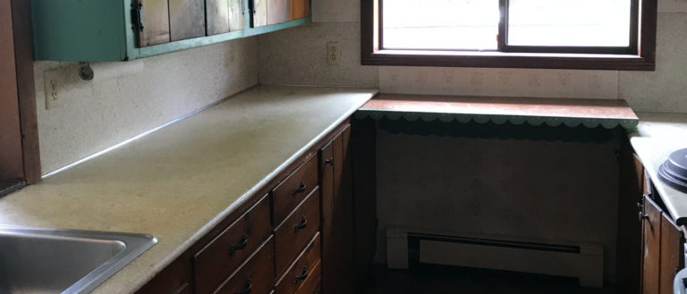 An old kitchen that has been throroughly cleaned out